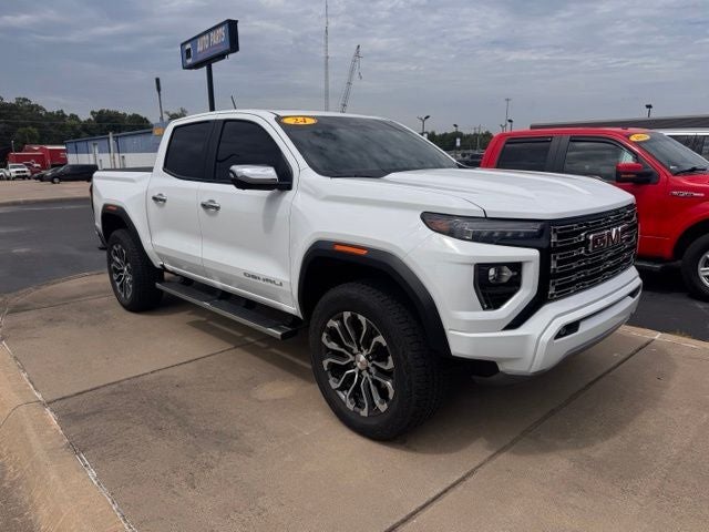 2024 GMC Canyon Denali in Summit White — front three-quarter view