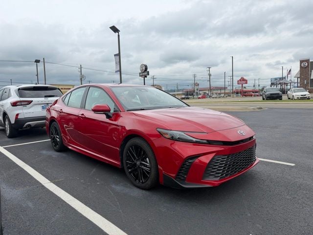 2025 Toyota Camry SE in Red — front three-quarter view